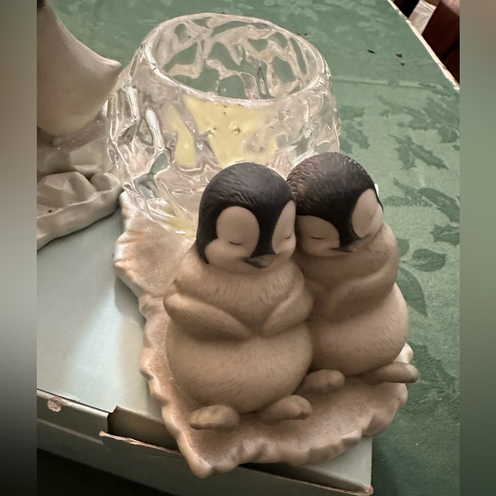 A pair of Party Lite baby penguins with crystal glass candle holders